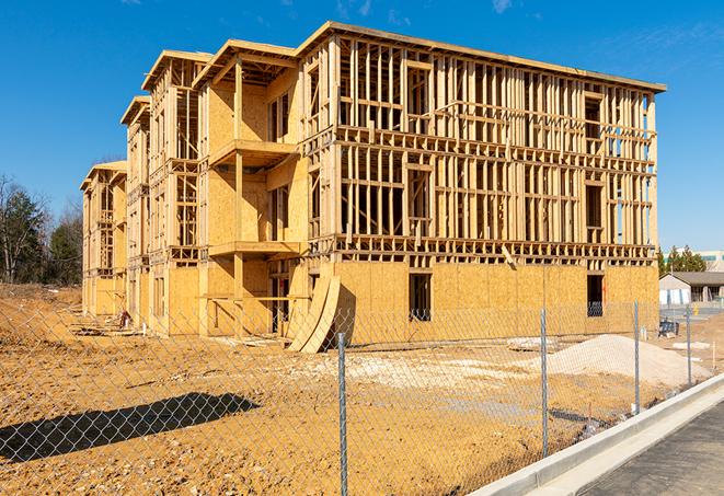 construction zone secured with a temporary fence, marked with warning signs in Anza CA